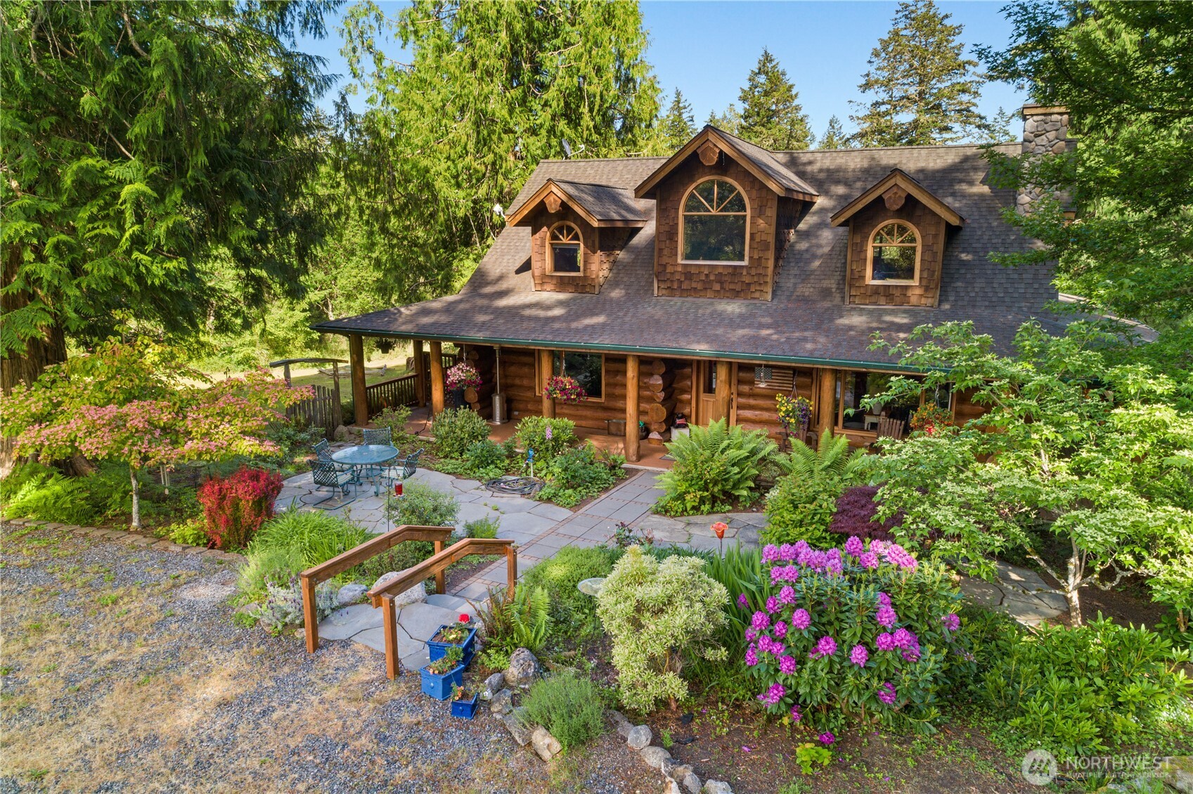 134 Sacred Moon Way Friday Harbor, WA 98250 - Photo 1 of 35 a front view of a house with a yard and porch