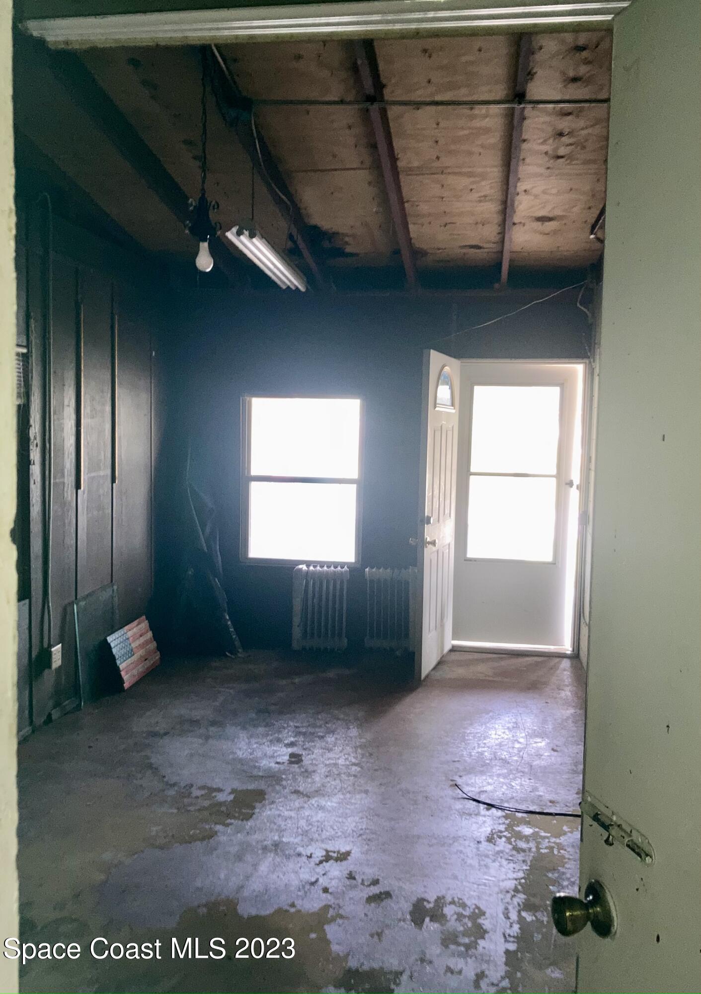 4396 Doncaster Drive Melbourne, FL 32935 - Photo 19 of 22 a view of an empty room with a window