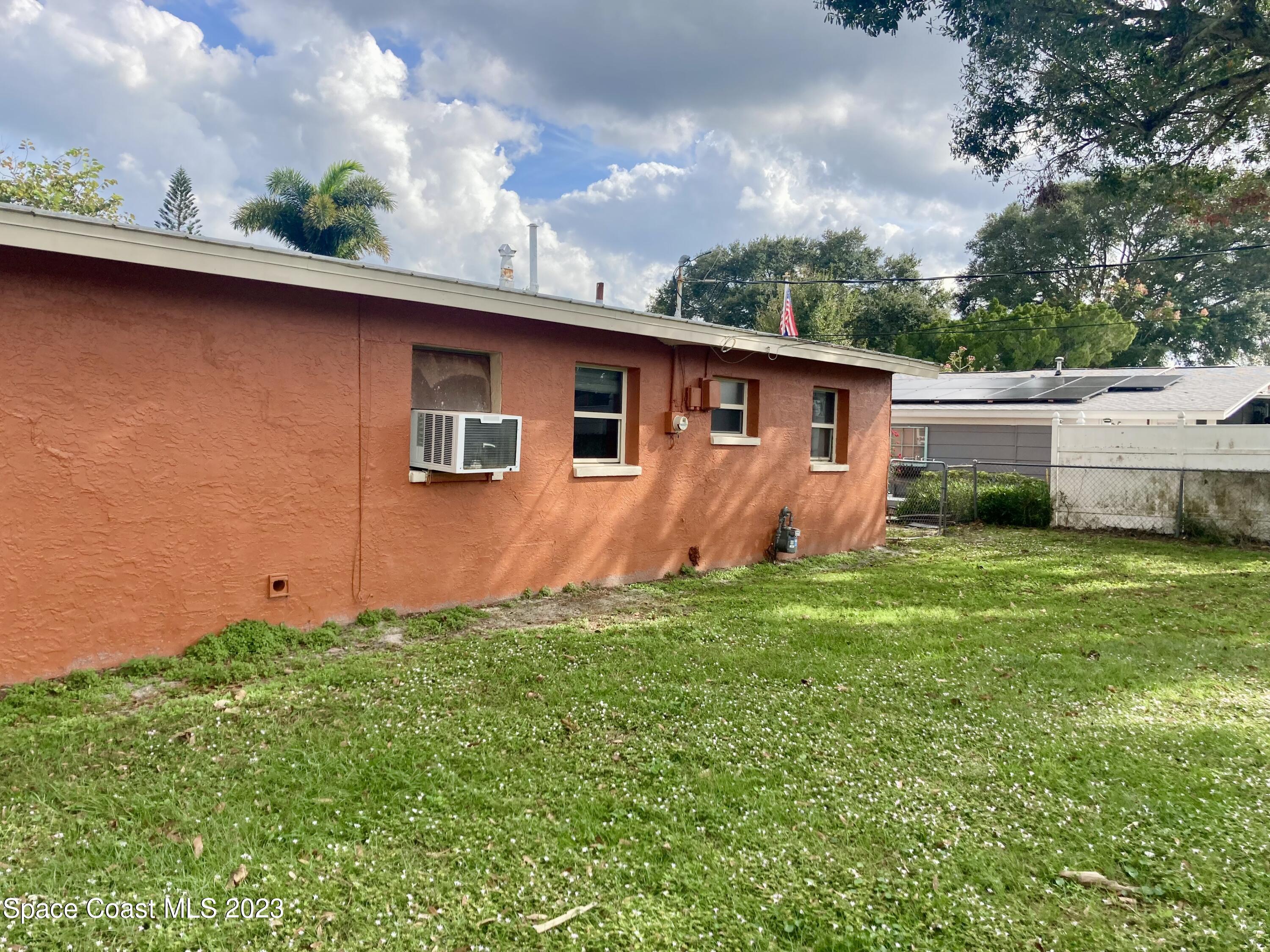 4396 Doncaster Drive Melbourne, FL 32935 - Photo 21 of 22 a backyard of a house with lots of green space
