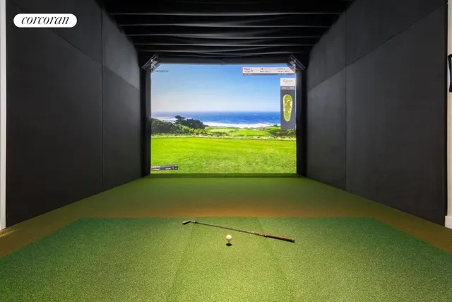 a living room with a table chairs and a large window