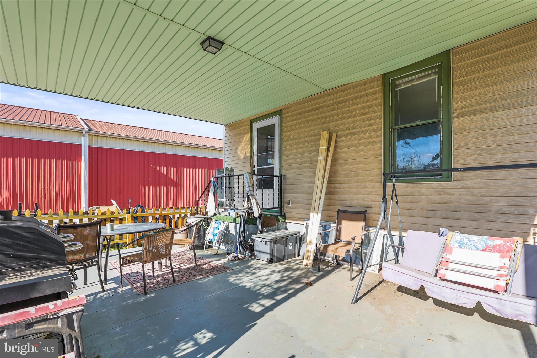 4 Penn Street Hanover, PA 17331 - Photo 20 of 28 an outdoor sitting area with couch and umbrella