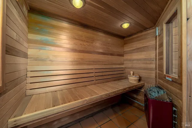 a living room with furniture a rug and a flat screen tv