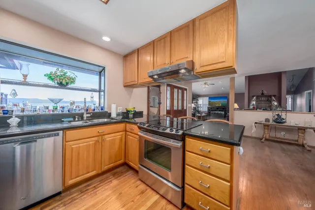 a bedroom with furniture and a chandelier