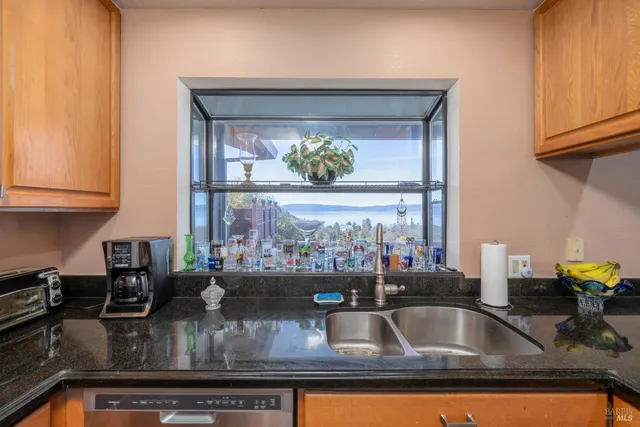 a spacious bedroom with a bed and a chandelier