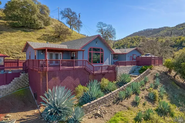 a chair and tables in the patio