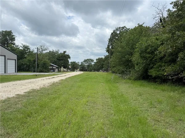 a view of outdoor space with deck and yard