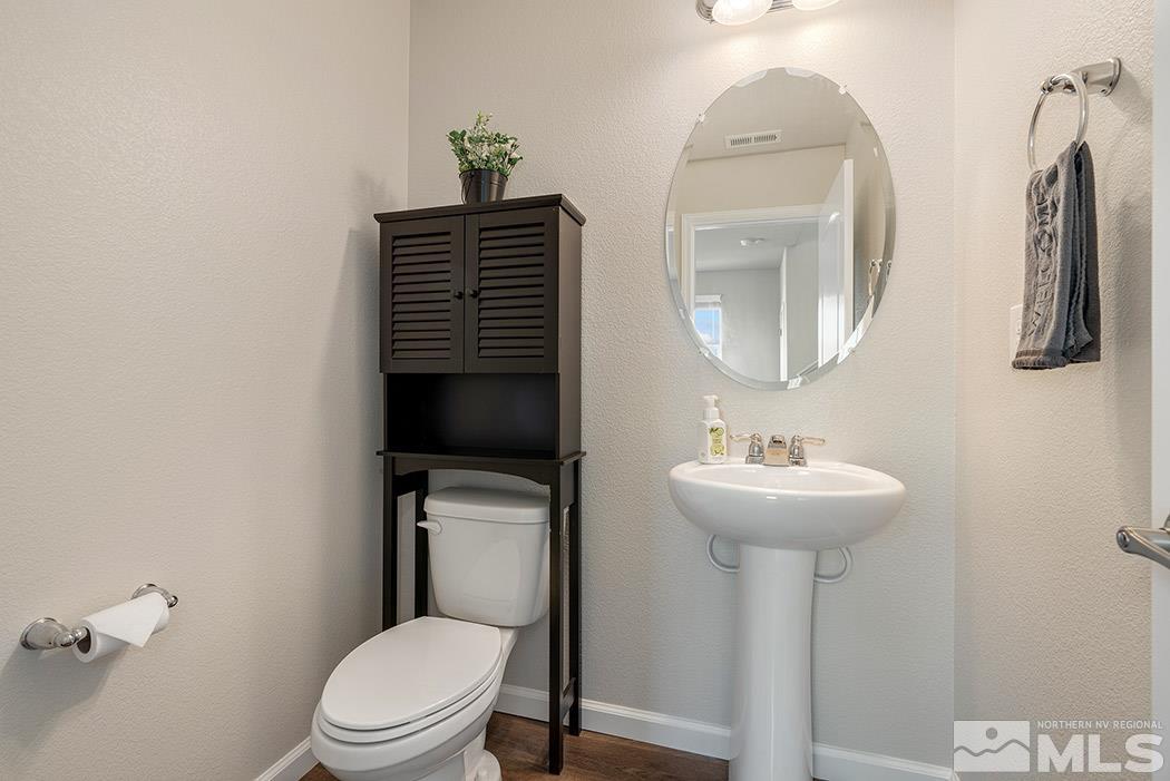2395 Soprano Reno, NV 89521 - Photo 11 of 27 a bathroom with a toilet sink and mirror