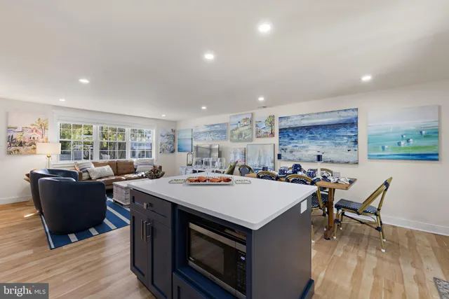 a kitchen with stainless steel appliances a refrigerator sink and cabinets