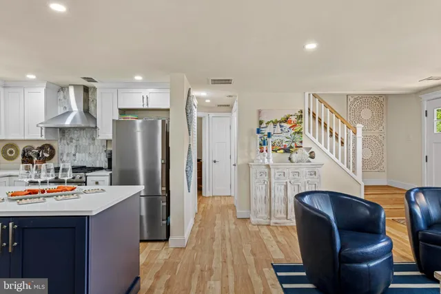 a bathroom with a sink toilet vanity and shower