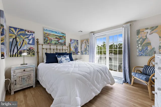 a bedroom with two beds and a window