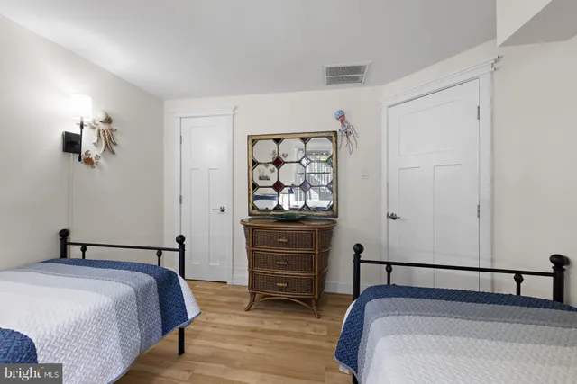 a bedroom with a bed and cupboard