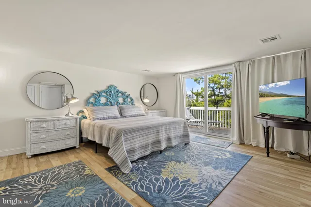 a bedroom with two beds and a dresser