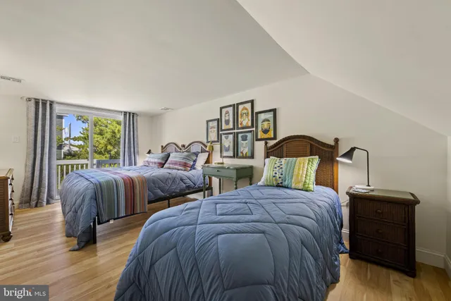 a view of a house with backyard sitting area and porch