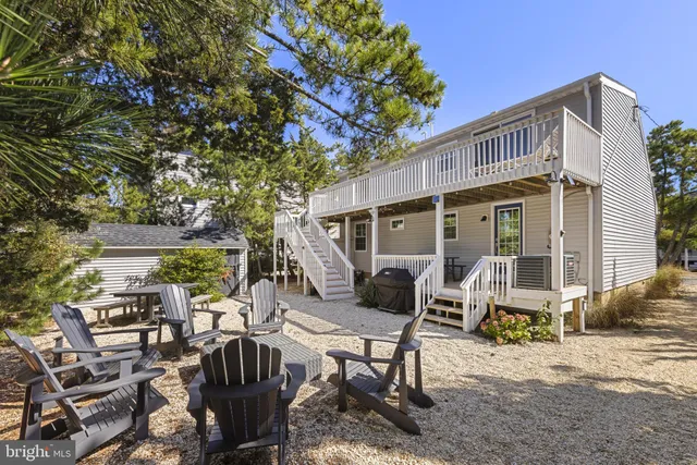 a view of balcony with wooden floor and fence