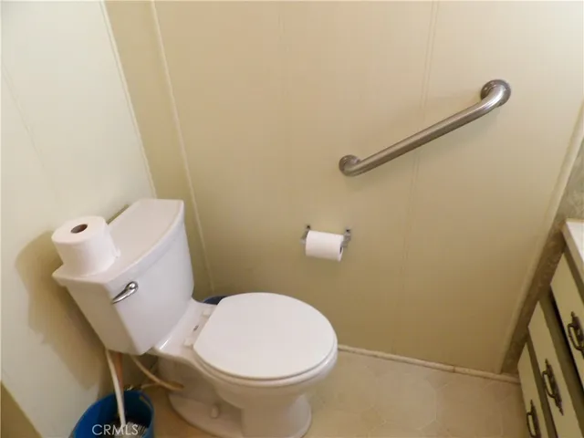 a view of a house with yard and lake view