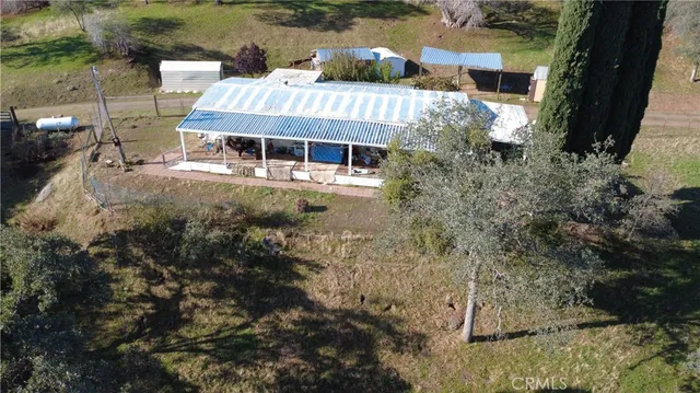 a view of a lake with couches and wooden floor