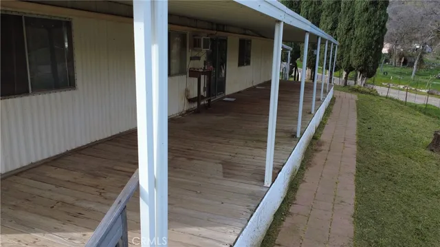 a view of a two tub sitting in backyard of house