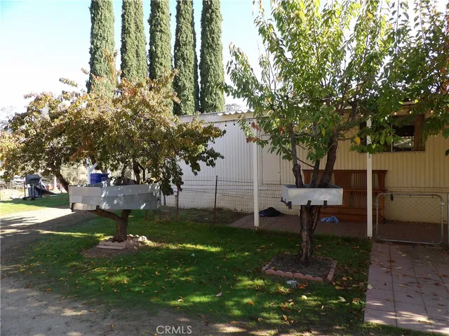 a backyard of a house with lots of trees