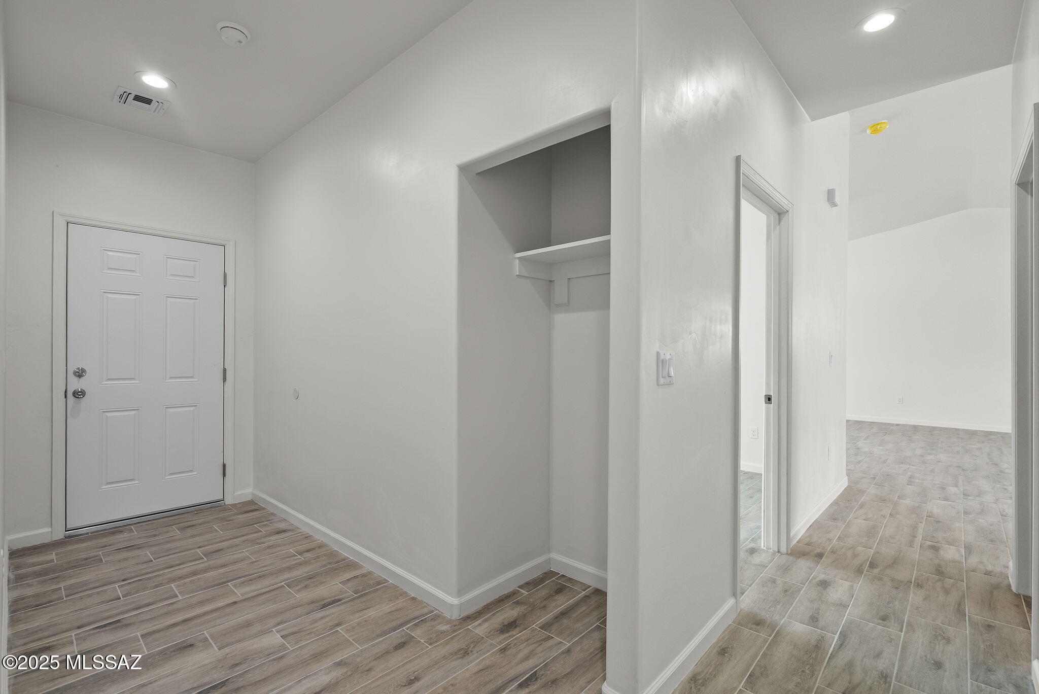 1895 Roma Court Rio Rico, AZ 85648 - Photo 25 of 42 a view of hallway with wooden floor