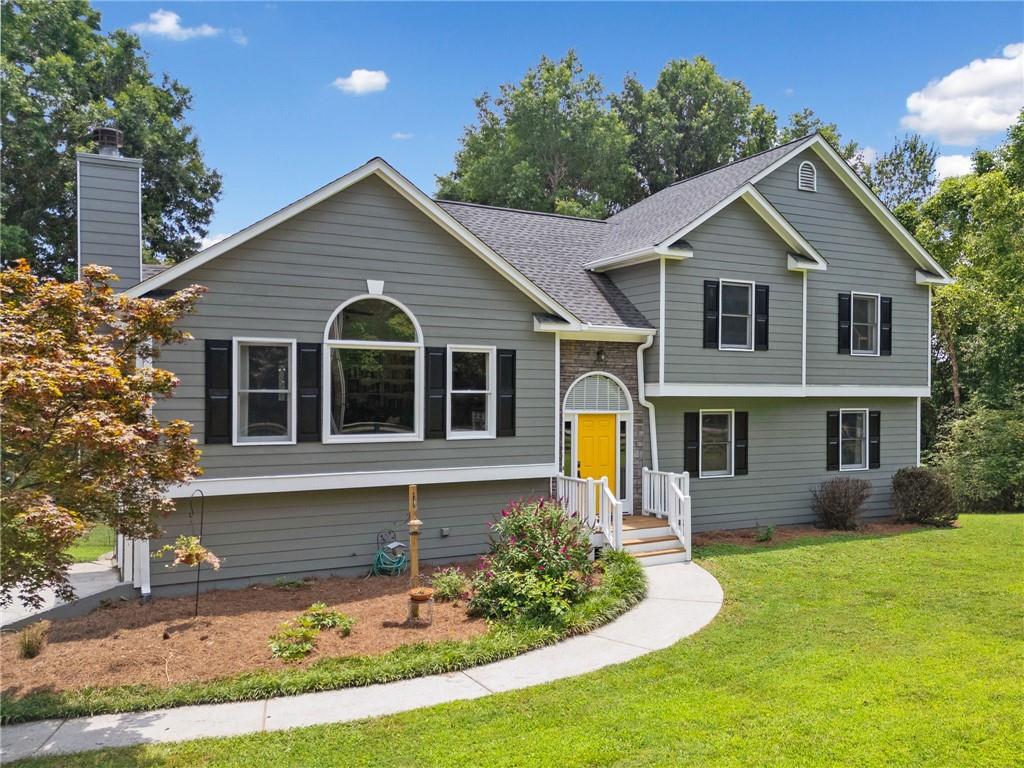 a front view of a house with a yard