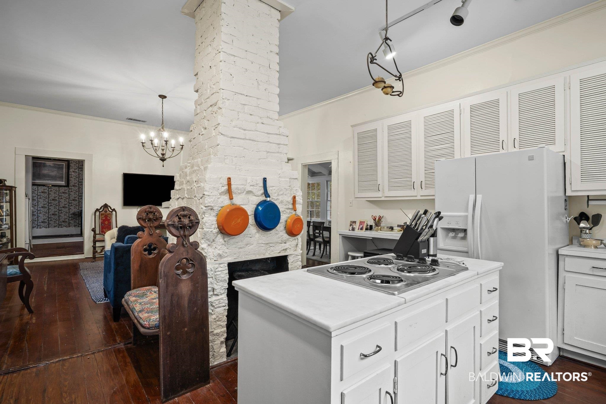 23561 Main Street Fairhope, AL 36532 - Photo 7 of 45 Kitchen featuring pendant lighting, white fridge with ice dispenser, a chandelier, a kitchen island, and light countertops