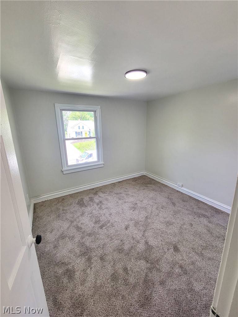 1557 Maplegrove Road South Euclid, OH 44121 - Photo 17 of 23 Empty room featuring carpet floors