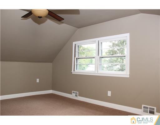 176 Kimberly Road Colonia, NJ 07067 - Photo 14 of 22 a view of an empty room with a window