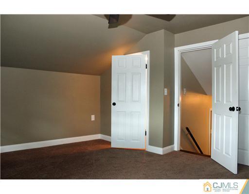 176 Kimberly Road Colonia, NJ 07067 - Photo 15 of 22 a view of an empty room with wooden floor