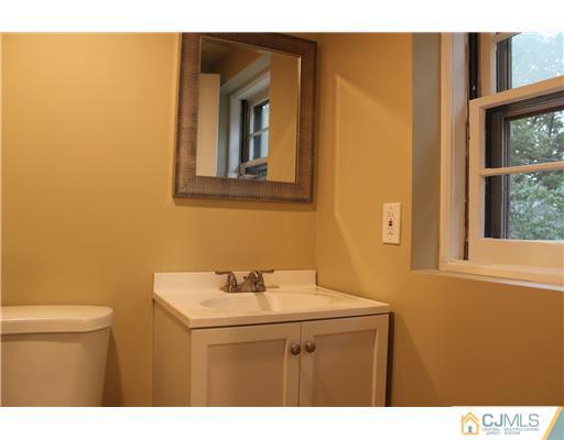 176 Kimberly Road Colonia, NJ 07067 - Photo 16 of 22 a bathroom with a sink and a toilet
