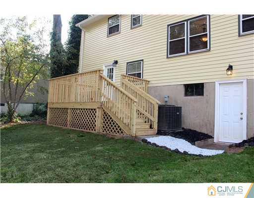 176 Kimberly Road Colonia, NJ 07067 - Photo 22 of 22 a view of a house with a yard and deck