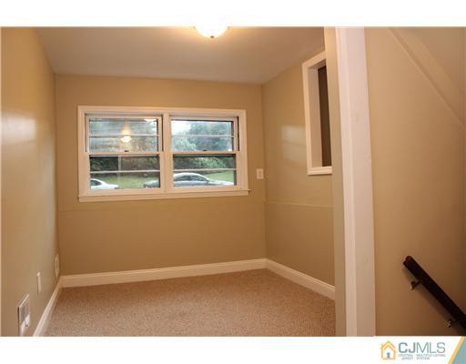 176 Kimberly Road Colonia, NJ 07067 - Photo 9 of 22 a view of an empty room with a window