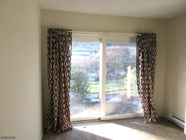 a view of outdoor space with sliding door and wooden floor
