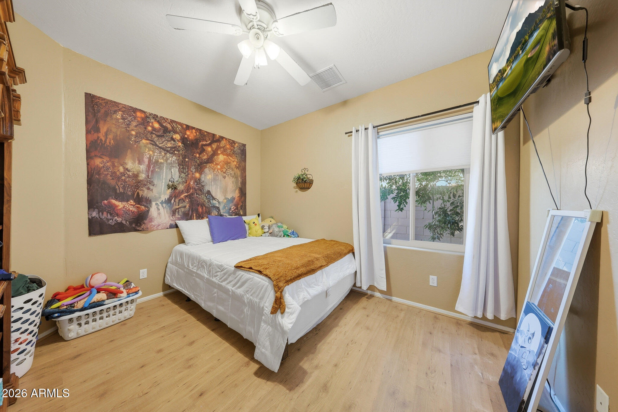 3897 East Cullumber Street Gilbert, AZ 85234 - Photo 30 of 51 a living room with a bed furniture and a large window