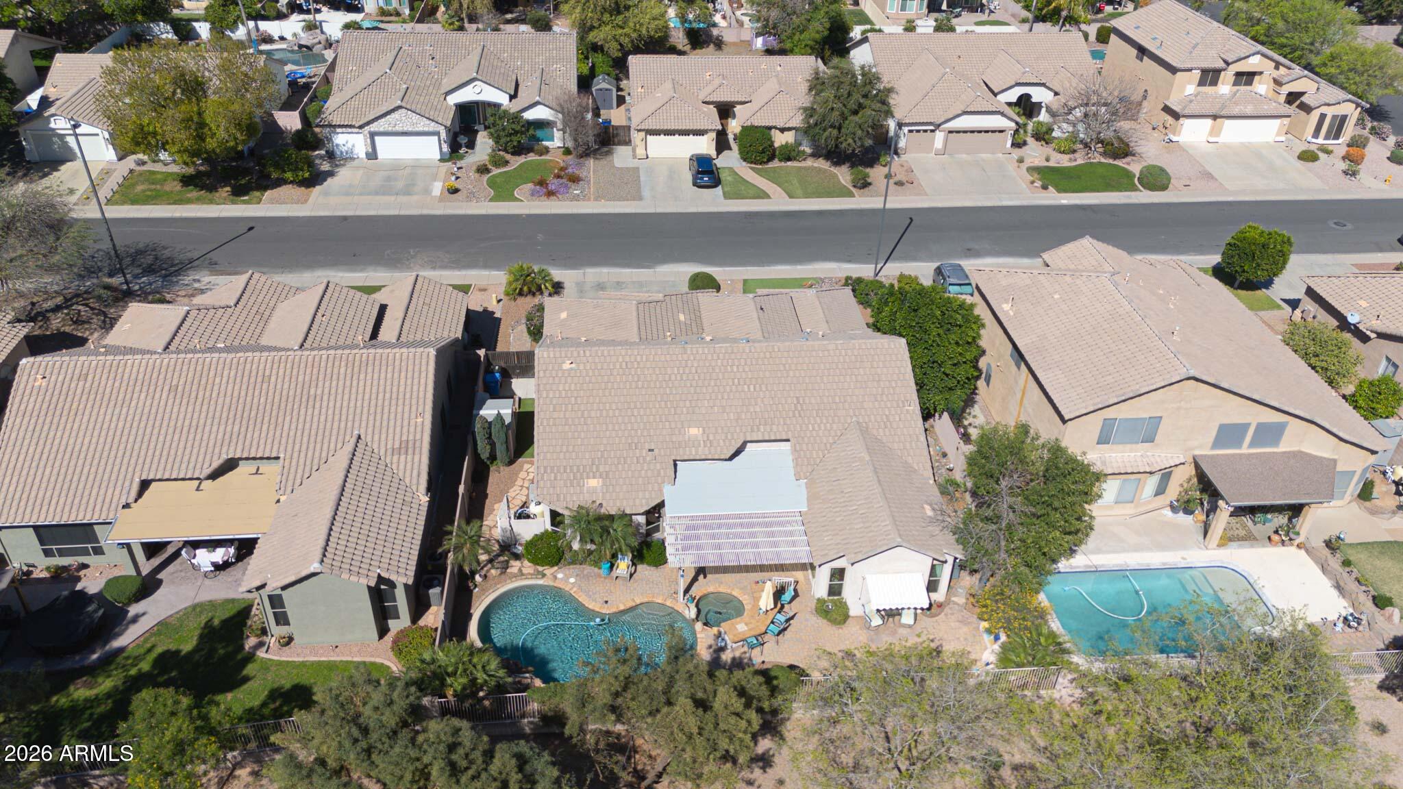 3897 East Cullumber Street Gilbert, AZ 85234 - Photo 46 of 51 an aerial view of residential houses with outdoor space and parking