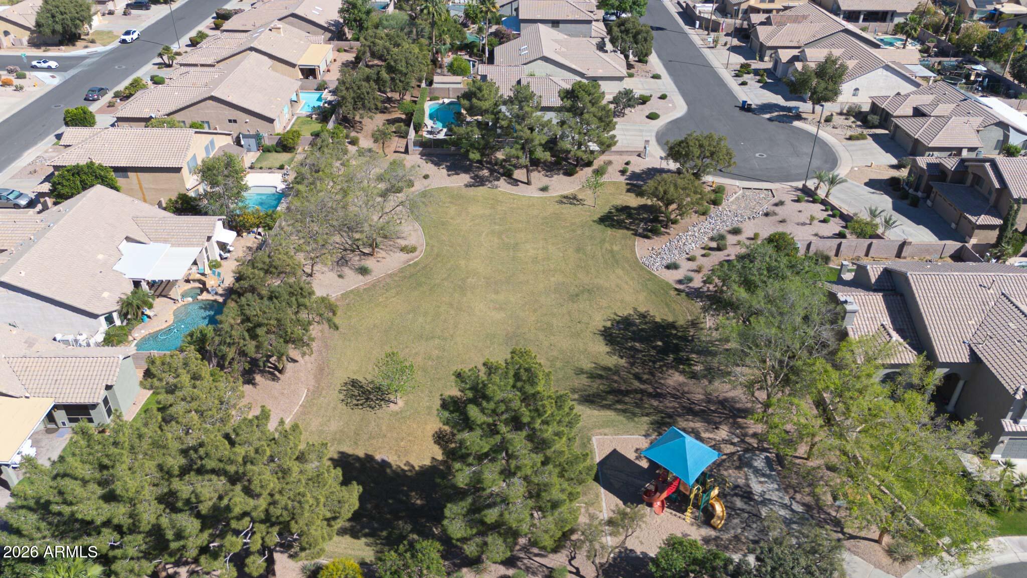 3897 East Cullumber Street Gilbert, AZ 85234 - Photo 51 of 51 an aerial view of a house with a yard and lake view