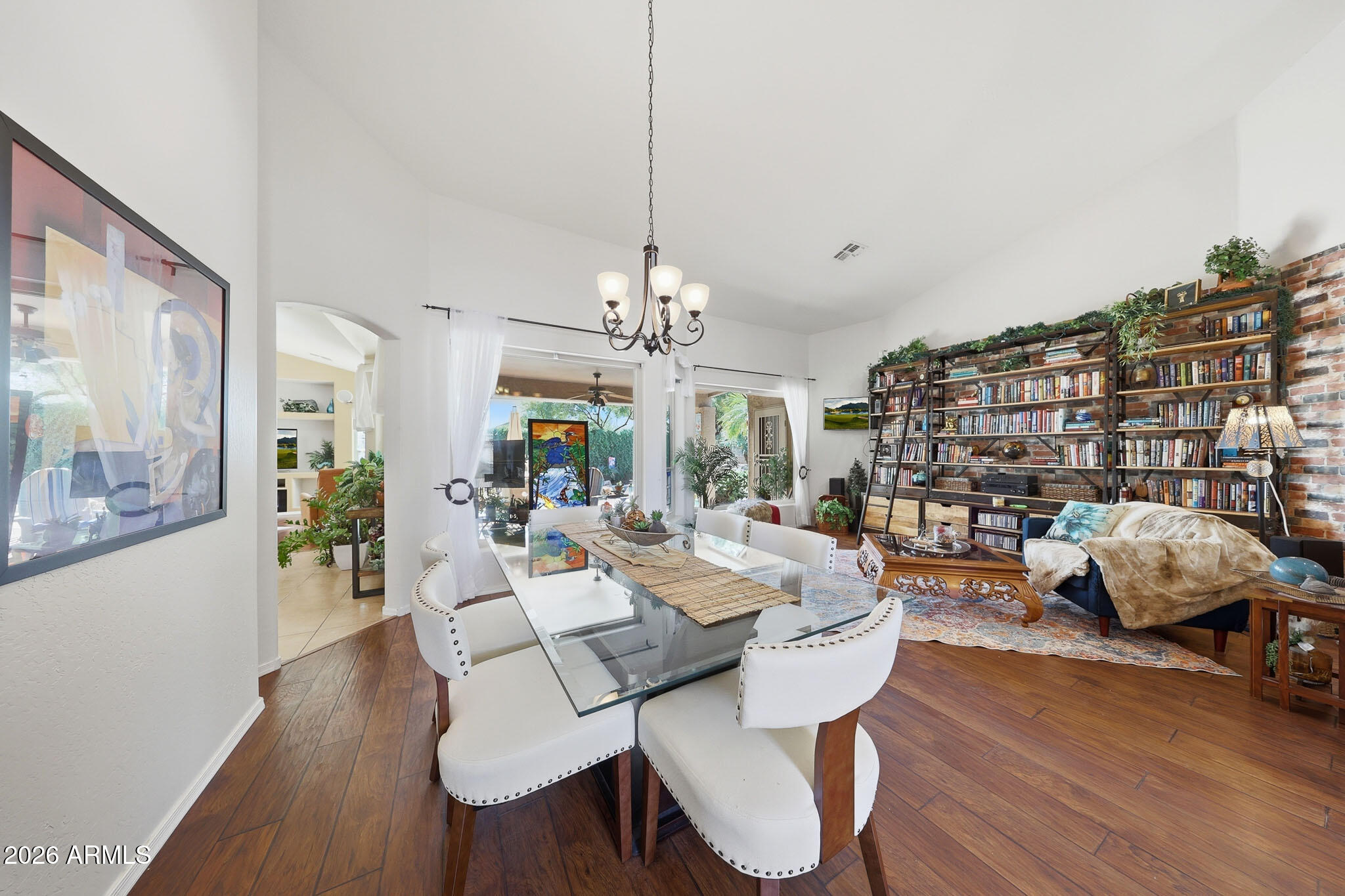 3897 East Cullumber Street Gilbert, AZ 85234 - Photo 6 of 51 a view of a dining room with furniture wooden floor and chandelier