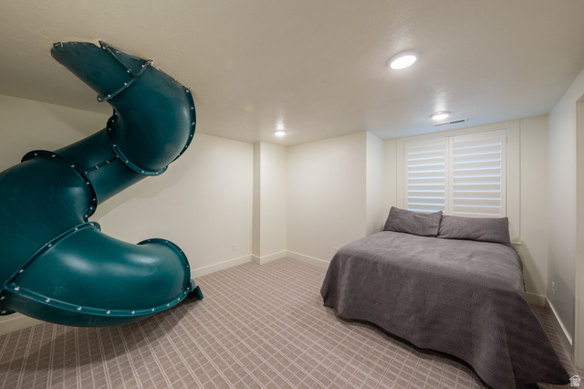 630 East Center Street Alpine, UT 84004 - Photo 75 of 115 Interior room featuring a built-in spiral slide, recessed ceiling lighting, textured wall-to-wall carpeting, and plantation shutters