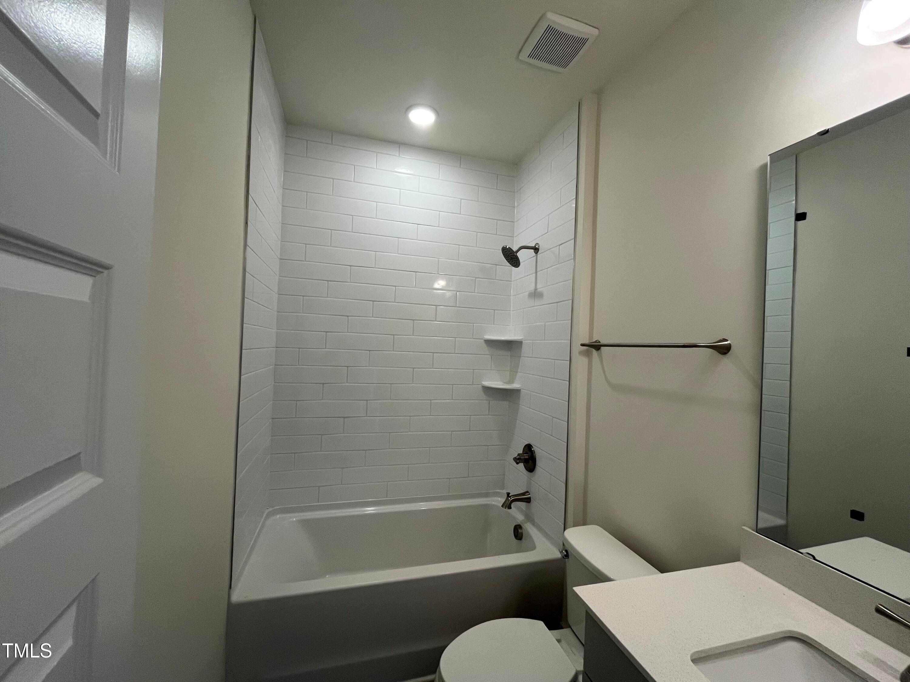 771 Old Station Pointe Angier, NC 27501 - Photo 6 of 35 a bathroom with a toilet and shower