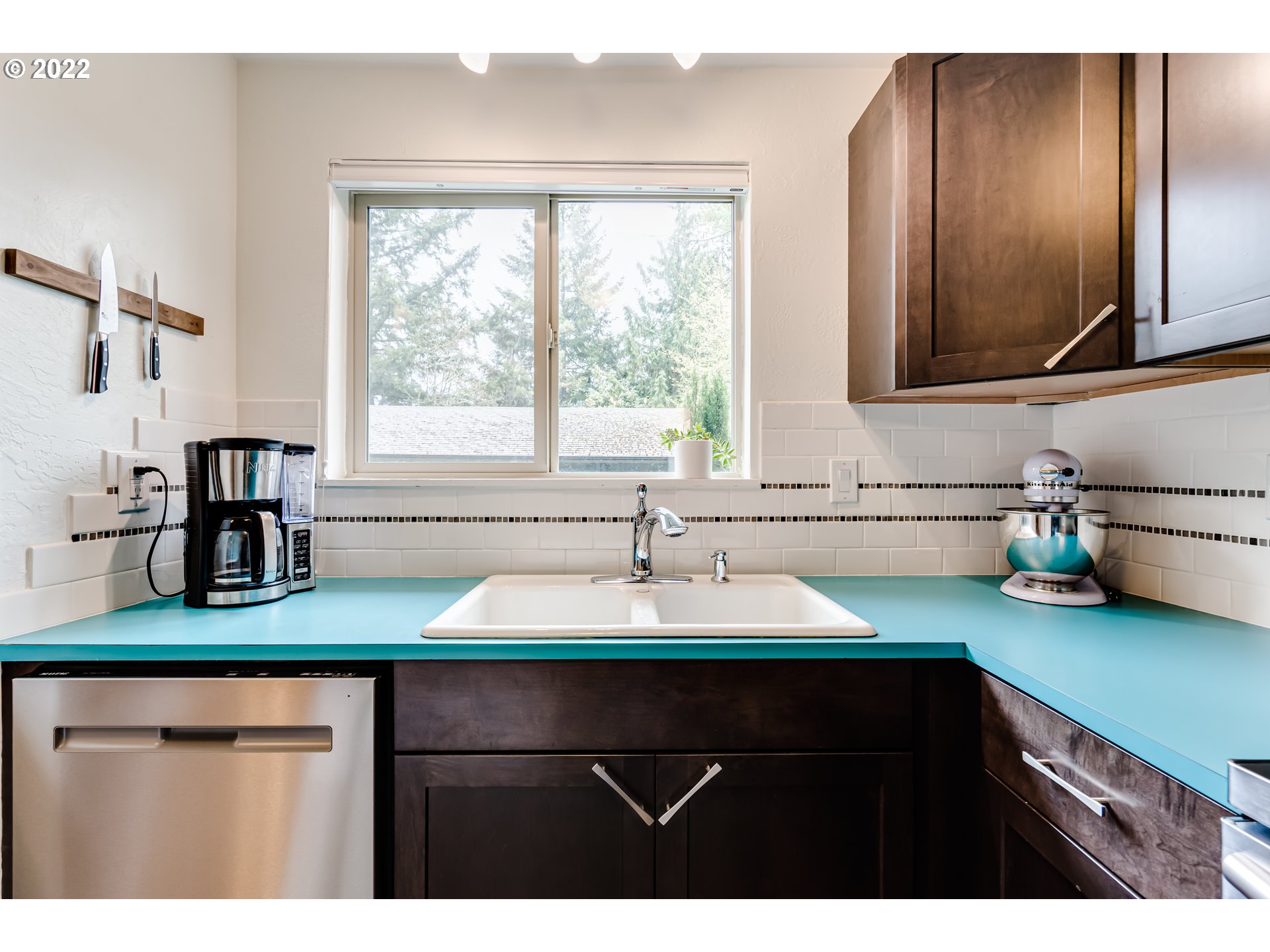 4433 Fox Hollow Road, Unit 1 Eugene, OR 97405 - Photo 4 of 30 a kitchen with sink cabinets and a window