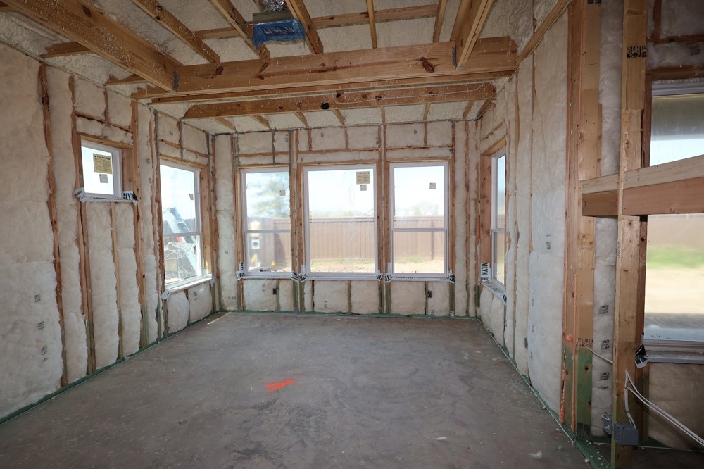 5222 Benton Wds Trail Rosenberg, TX 77471 - Photo 6 of 12 a view of an empty room with large windows