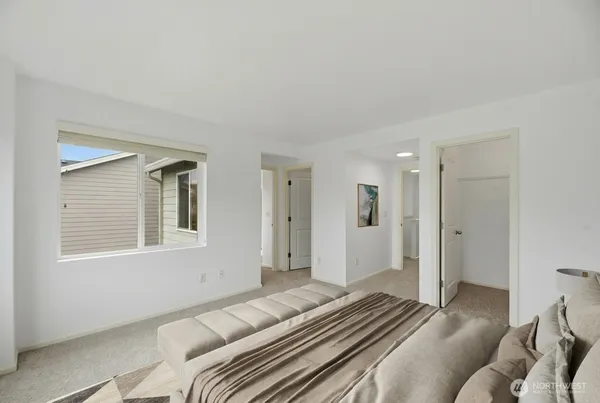 a bedroom with a bed and a couch