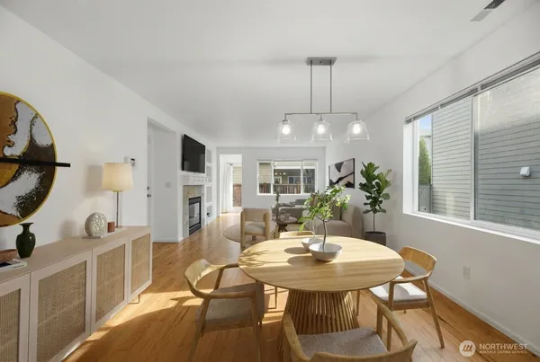 a view of a dining room with furniture and window
