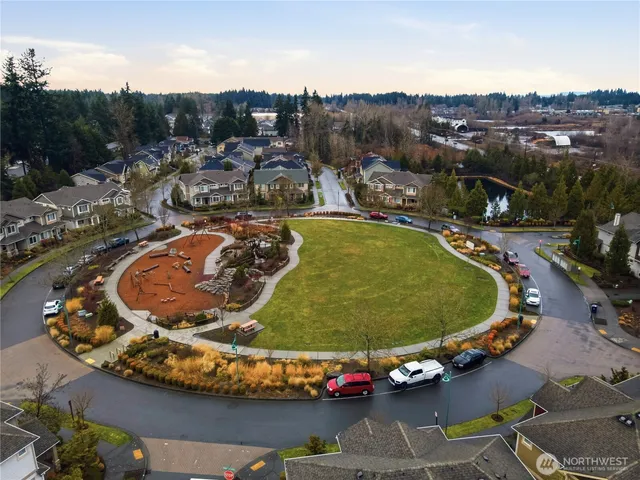 a view of a swimming pool with a lot of cars parked