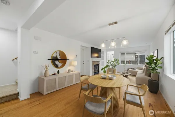 a view of a dining room with furniture window and wooden floor