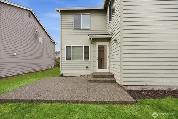 a view of house with backyard and garden