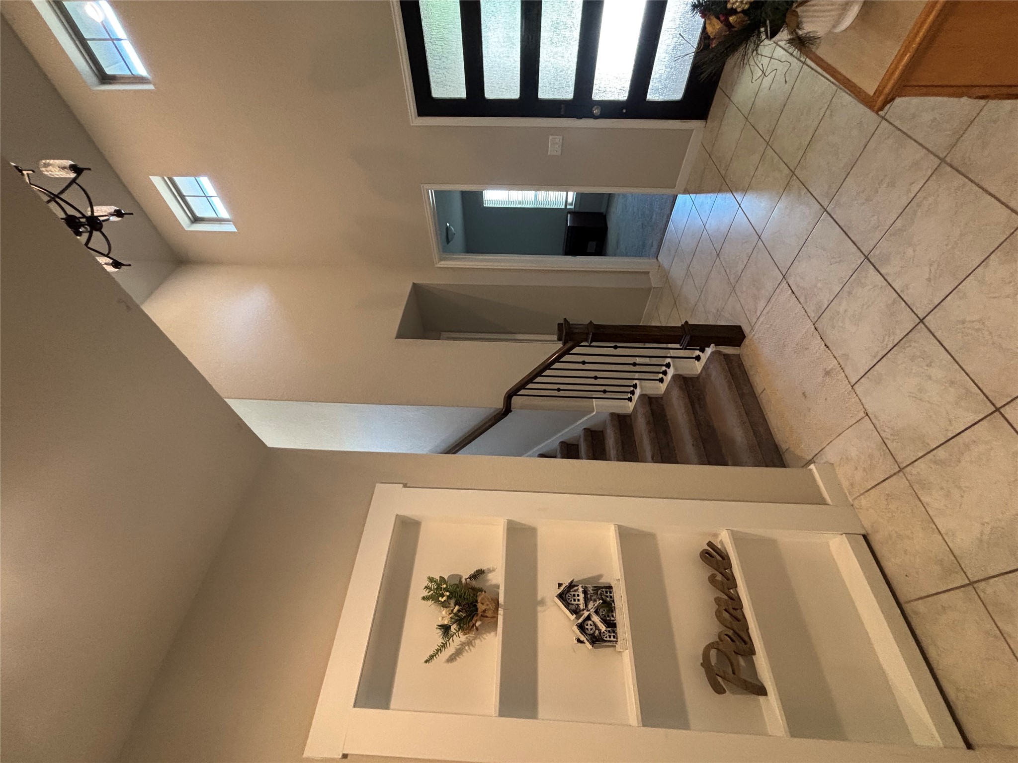 2017 Palmera Ridge Boulevard Leander, TX 78641 - Photo 4 of 6 A grand entrance welcomes with soaring ceilings and inviting tile flooring.