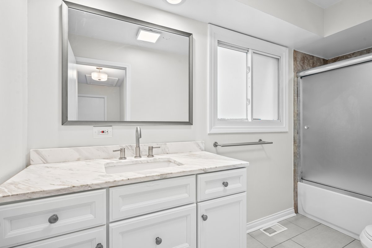 2500 Green Bay Road Highland Park, IL 60035 - Photo 13 of 18 a bathroom with a sink and a mirror