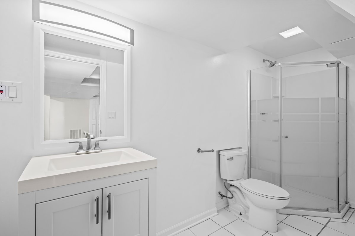 2500 Green Bay Road Highland Park, IL 60035 - Photo 15 of 18 a bathroom with a sink toilet and shower