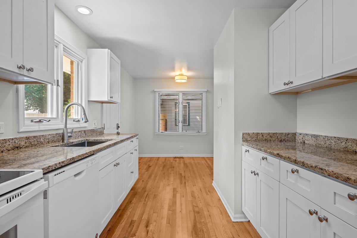 2500 Green Bay Road Highland Park, IL 60035 - Photo 8 of 18 a bathroom with a granite countertop sink and cabinets
