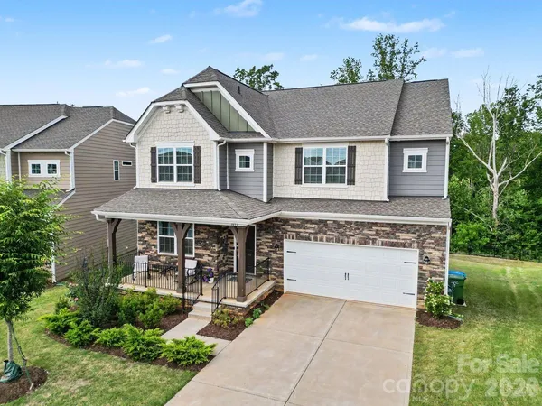 a aerial view of a house with yard and plants